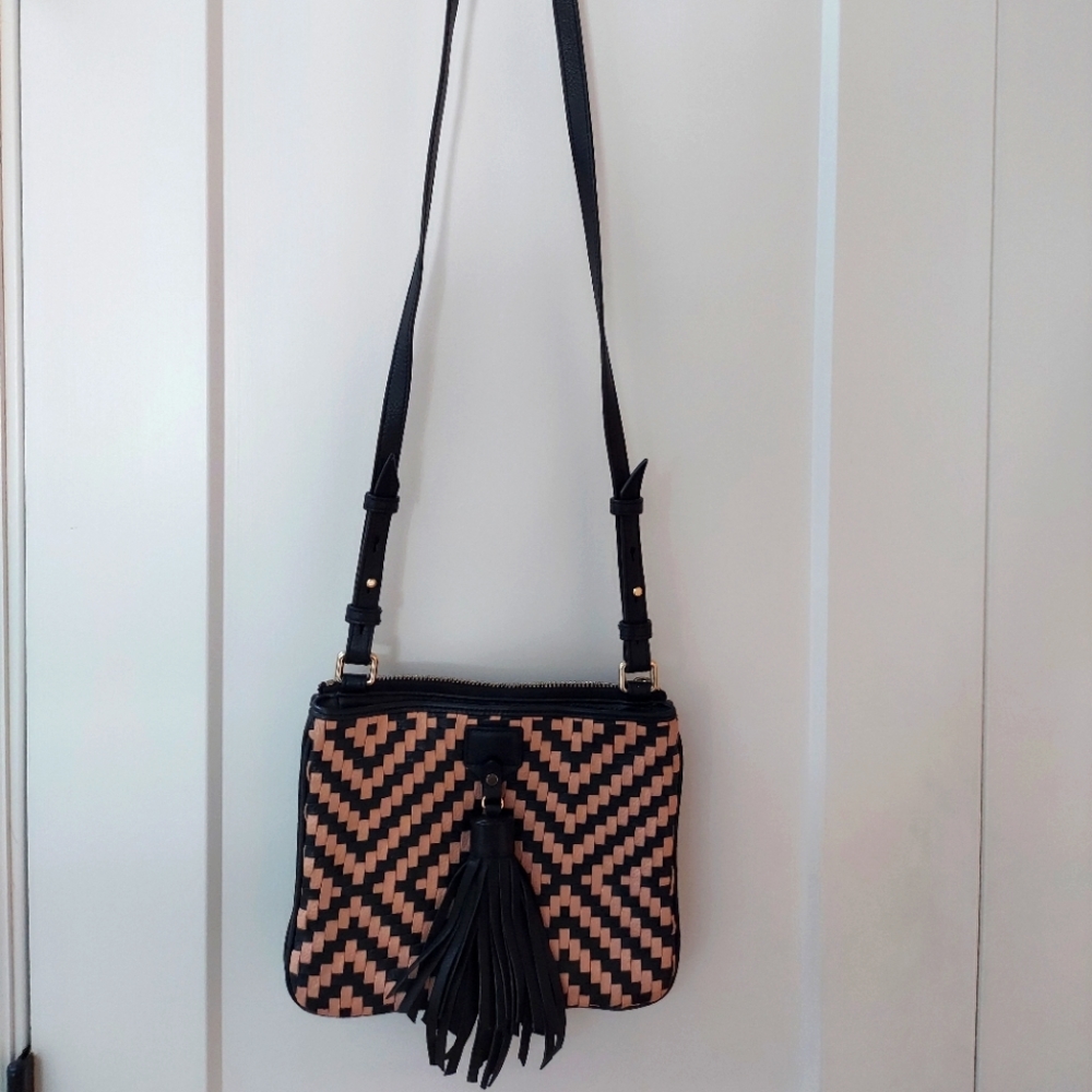 Cole Haan tan and black weaved crossbody bag